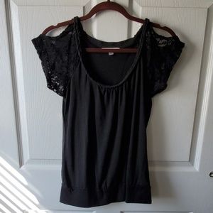 Open cut shoulder, wide neak shirt.